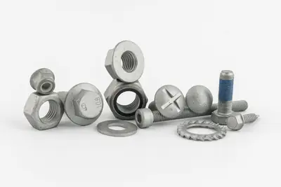 Vis, écrous et rondelles revêtus de zinc lamellaire
